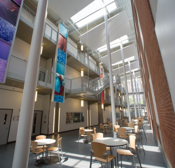 Science & Mathematics Complex - 3 story atrium showing skylights, seating and graphic panels